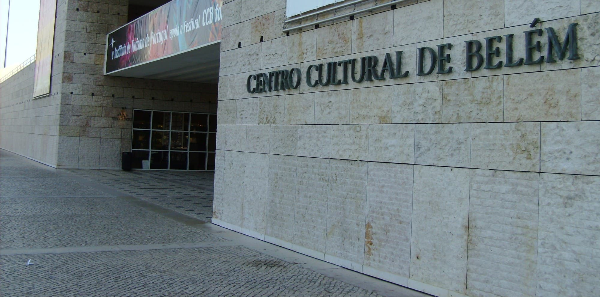 The stone entrance facade and lettering of Centro Cultural de Belém in Lisbon.